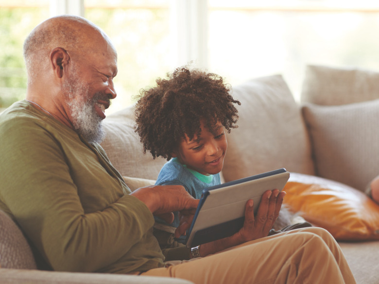 Man and child using FIOS