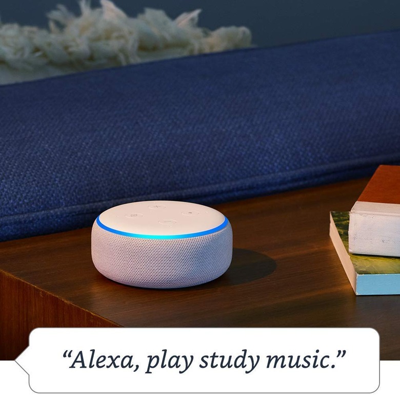 Amazon Echo Dot next to books
