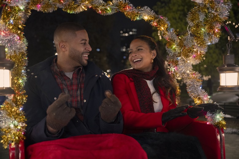 Devale Ellis as Teddy and Christina Milian as Layla in Meet Me Next Christmas.