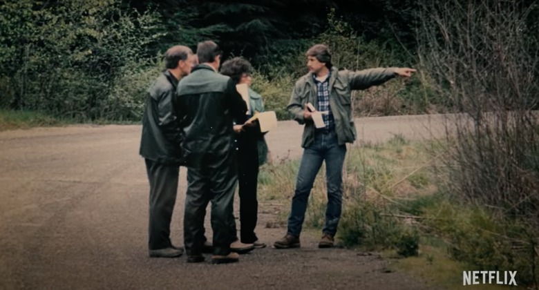 group of men talking in catching killers trailer