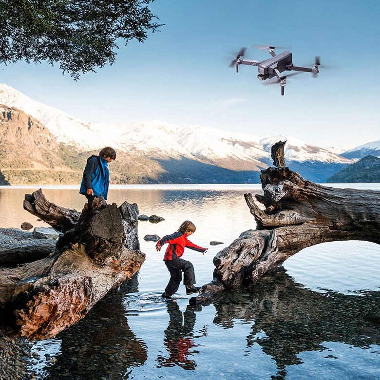 A camera drone flying through the air