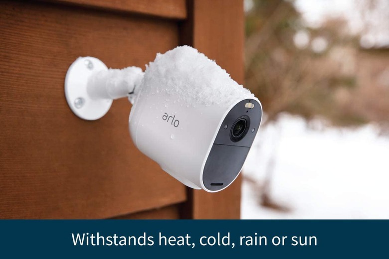 Arlo Essential Spotlight Camera installed on the side of someone's home