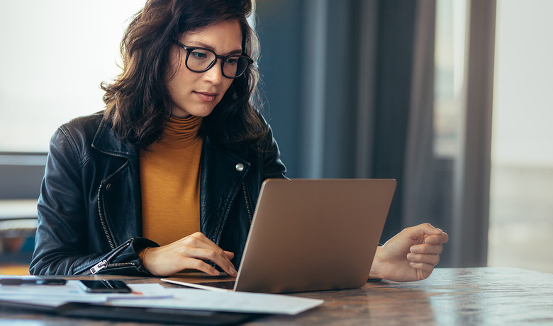 Woman Working Typing On Laptop Computer