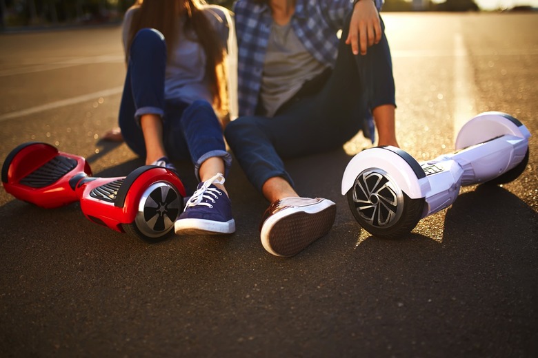 Hoverboard riders resting on the ground.