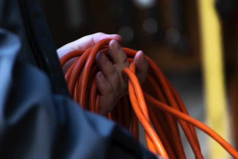 Orange extension cord in use.
