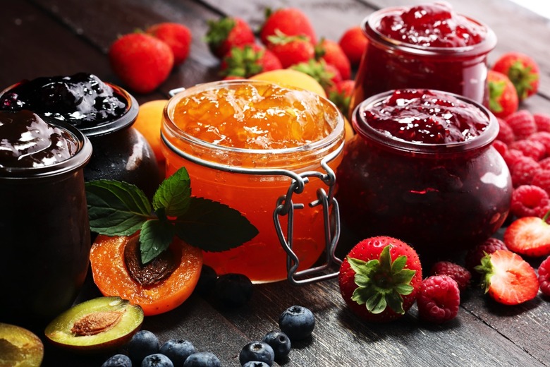 Fruit and jams on a table.