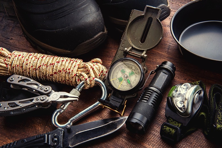 Outdoor travel equipment including a flashlight