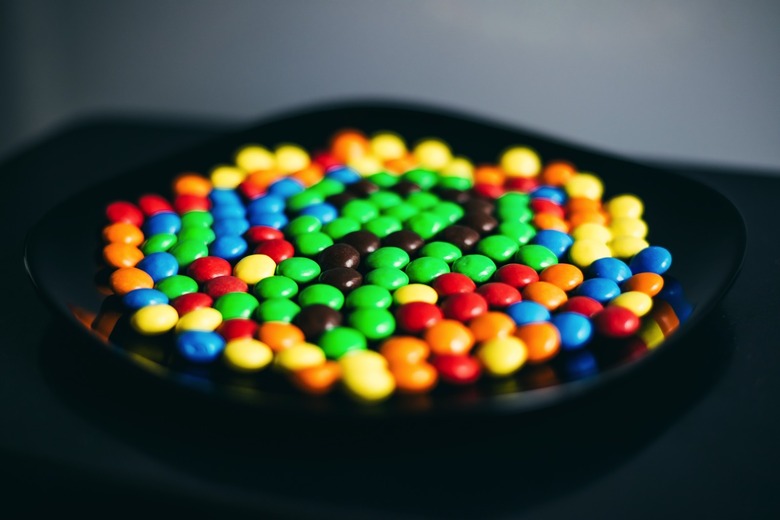 Colorful Skittles-like candy in a bowl.