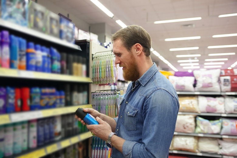 A person looking at deodorants in a store