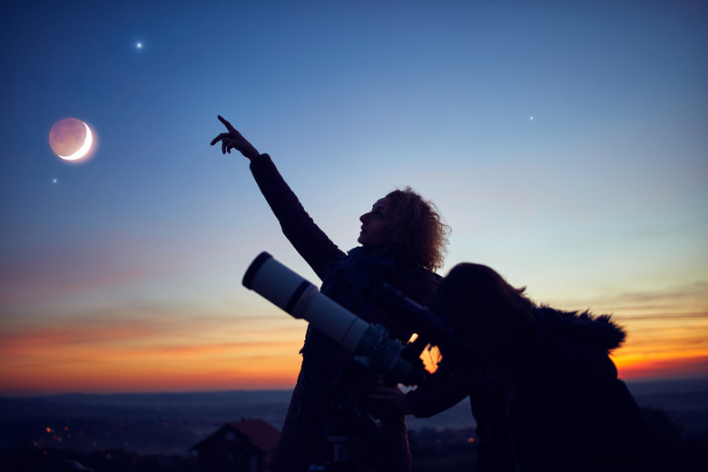two people watching cosmic events in 2023