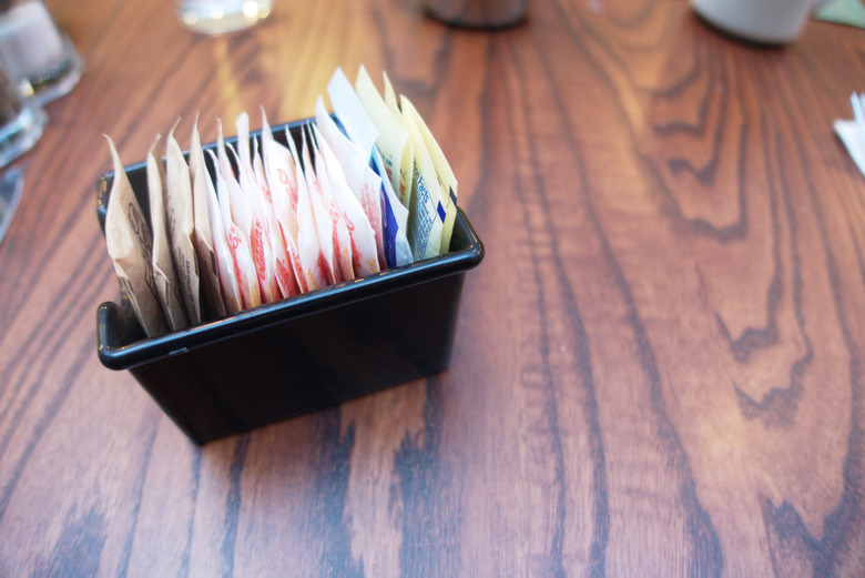 artificial sweeteners on coffee shop table