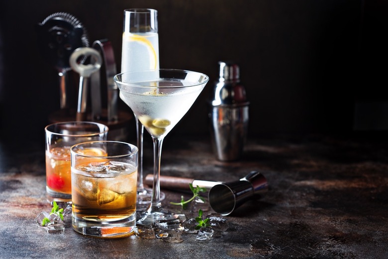 Variety of alcoholic cocktails on dark background.