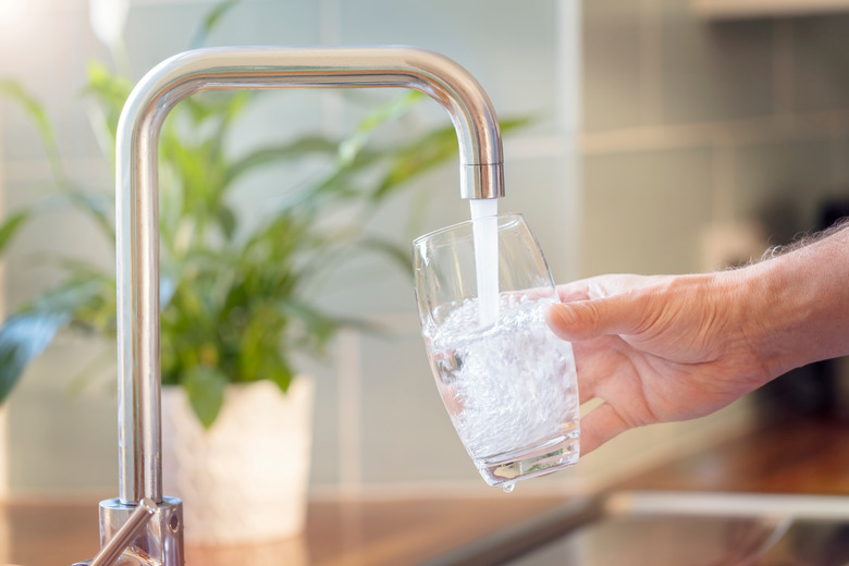 filling glass at faucet