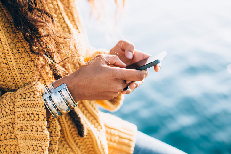 closeup of woman texting on iphone