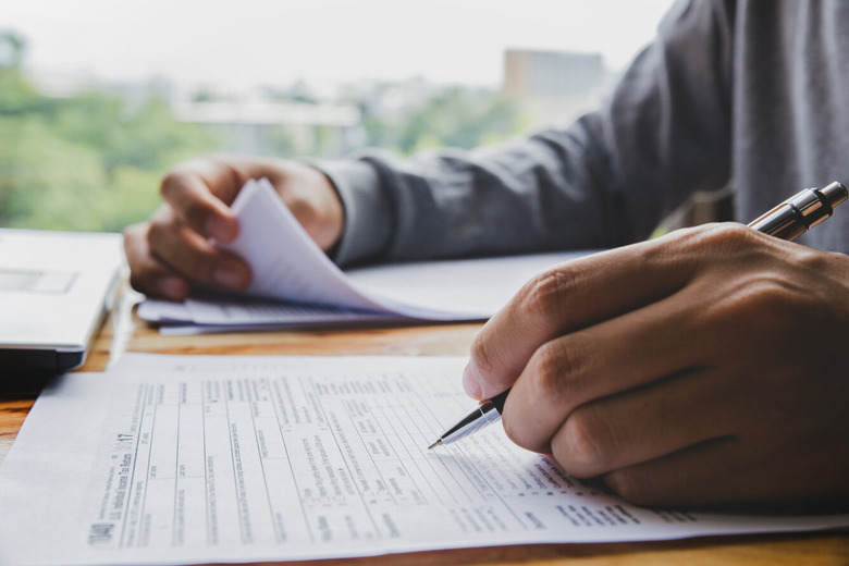 filling out tax papers