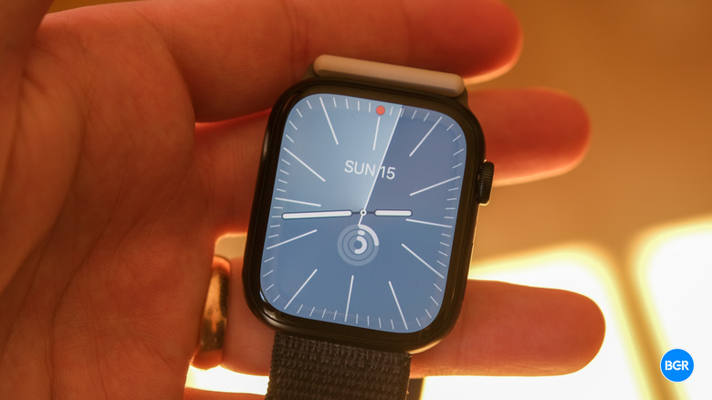 An Apple Watch Series 9 in hand.