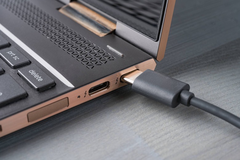 USB-C cable in laptop connector plug