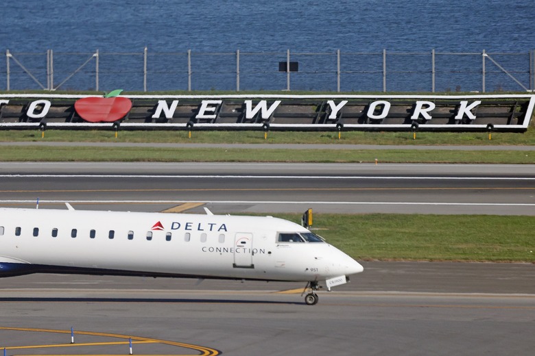 A Delta Airlines jet moves along the runway at Laguardia AIrport on November 10, 2022 in the Queens borough of New York City.