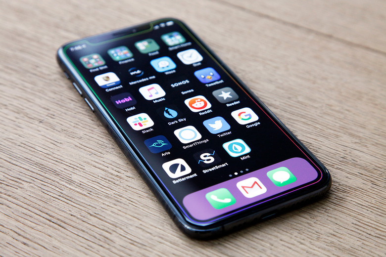 iPhone XS sitting on a table.