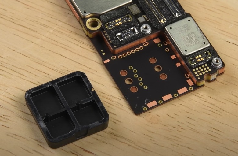 iPhone 14 Pro Max logic board with the plastic piece removed.