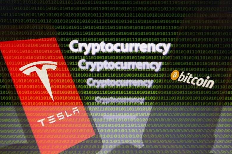 Logos of Tesla and Bitcoin on Smartphone
