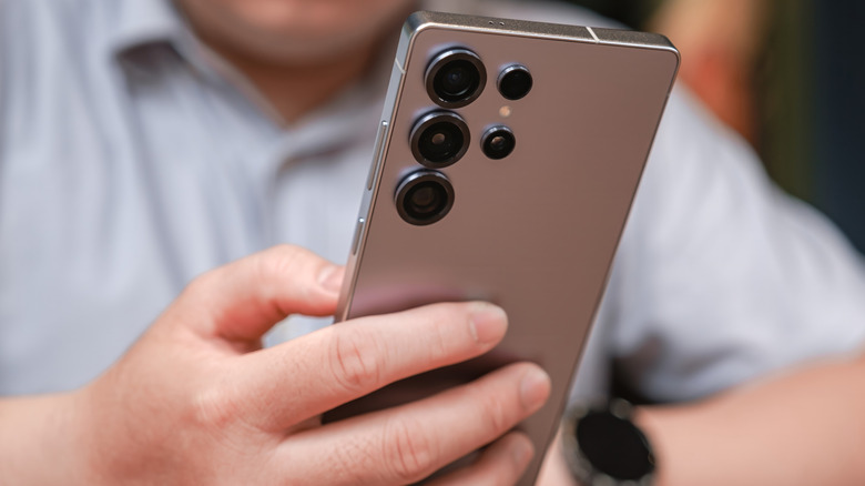 Samsung Galaxy S25 Ultra held in hands and in use.