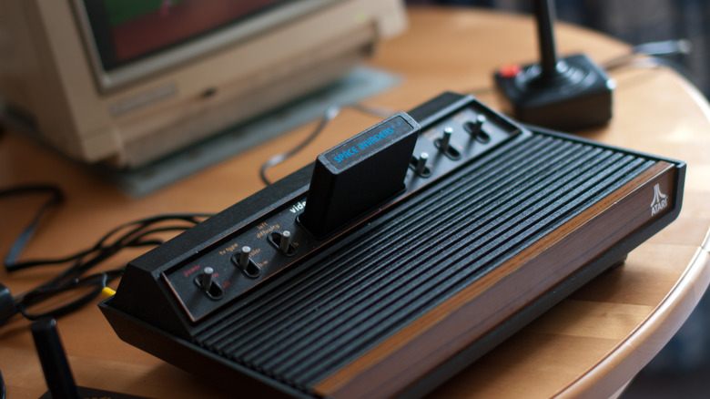 The Atari 2600 console with joysticks and an inserted game cartridge