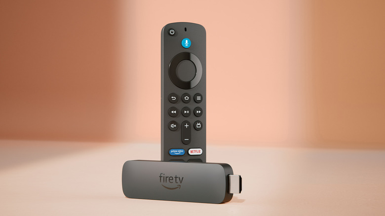 The Amazon Fire TV Stick 4K Plus streaming device with its remote.