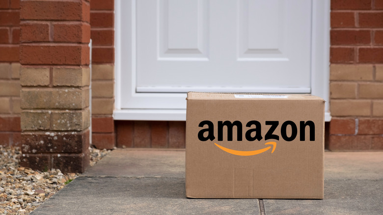 An Amazon box outside a front door.