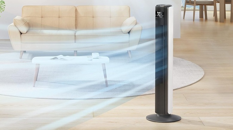 Levoit Tower Fan blowing air out into a living room