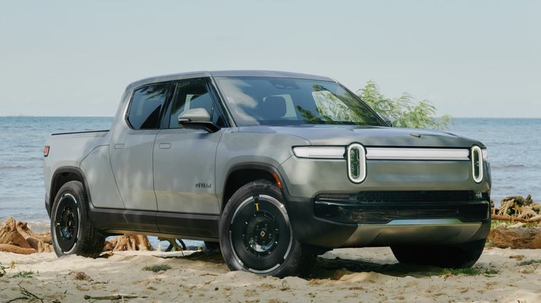 Rivian R1T standing on a beach