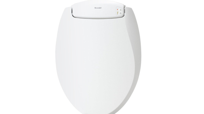 Brondell toilet seat on a white background, highlighting the controls at the base