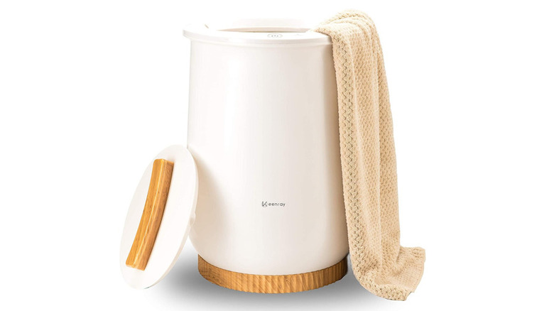 Keenray towel warmer with a towel hanging out the side