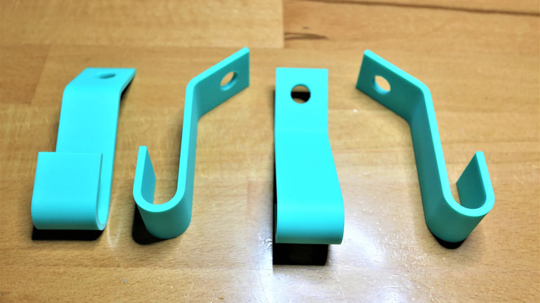 Blue coat hanger hooks on a wooden table