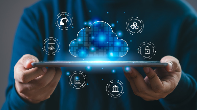 Person holding device illustrating cloud computing concept