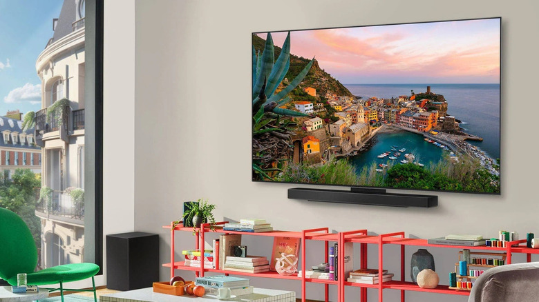 The LG C5 TV mounted on the wall of an upscale house