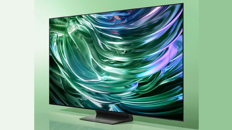 The Samsung S90D on a green background