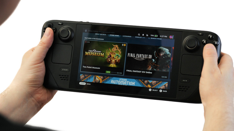 Person tapping on the D-pad of a Steam Deck
