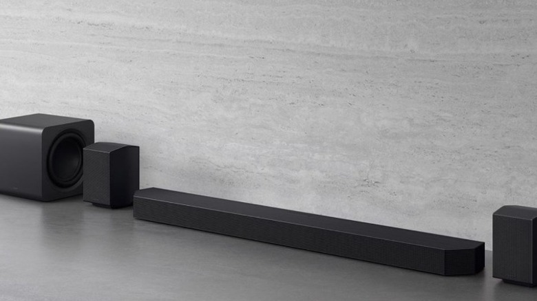 The Samsung Q990F soundbar system on a gray background
