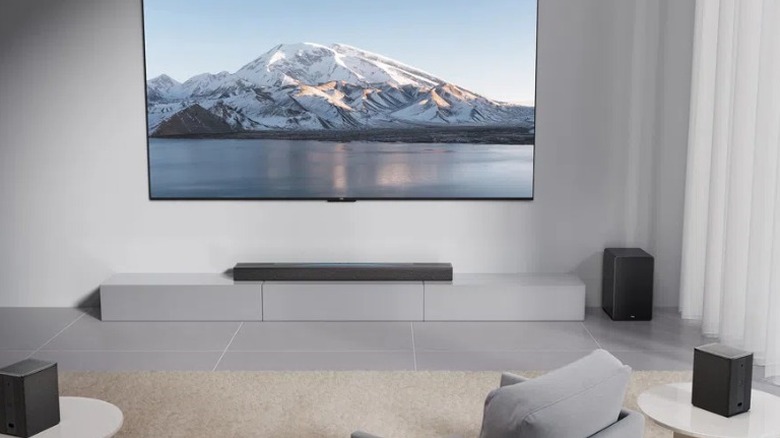The TCL Q85H soundbar system in a modern living room