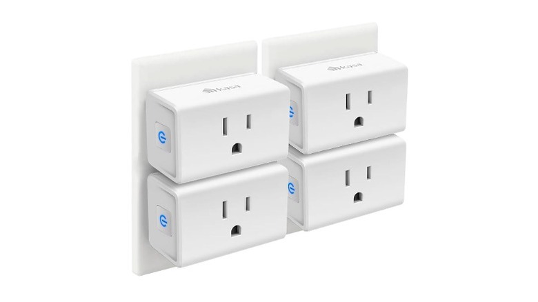 Four white smart plugs