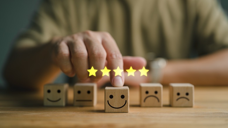 Blocks with different emojis printed five stars above it