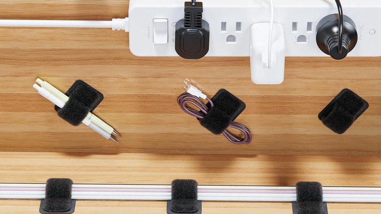 Cables neatly secured with multiple hook-and-loop ties beneath the desk