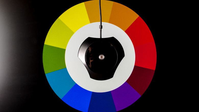 A TV calibration tool against a TV screen.