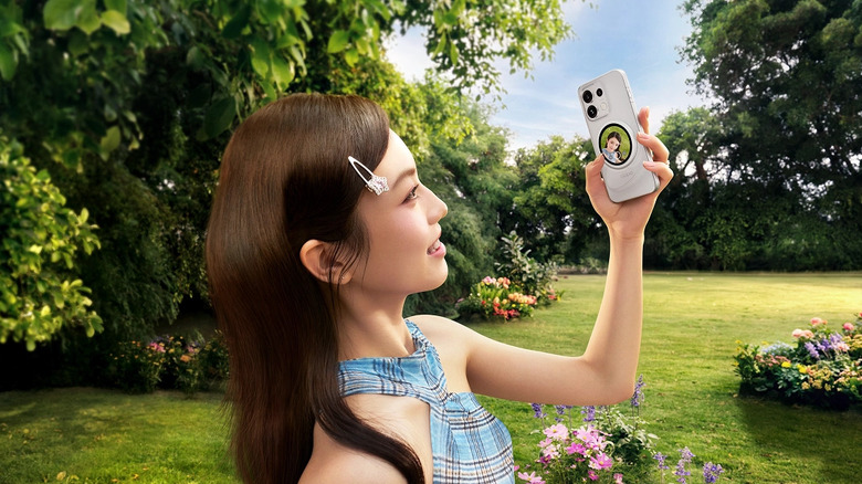 A person taking a photo with Oppo Bubble Selfie Screen