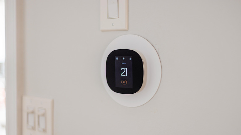 a smart thermostat on a wall