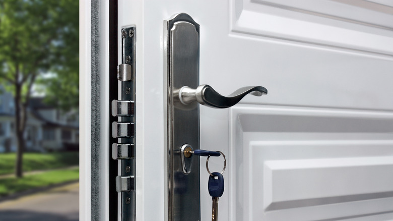close up of a door handle with visible locks