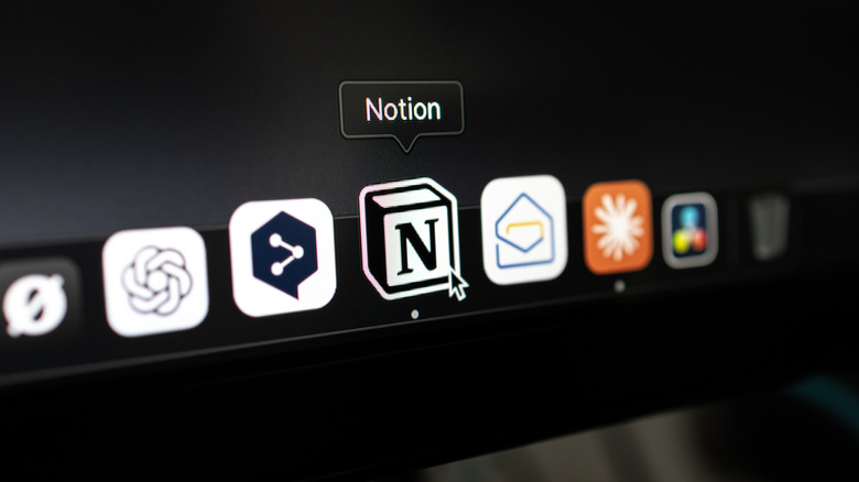 Close-up of a MacBook Pro 16-inch with M4 Max Ultra chip running macOS, showing Microsoft Excel, Word, and PowerPoint icons in the dock.