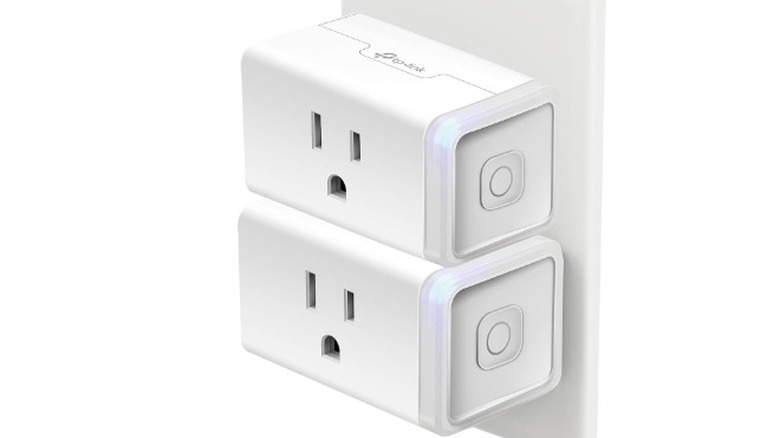 An image render of two Kasa Smart Plugs connected to a wall outlet.