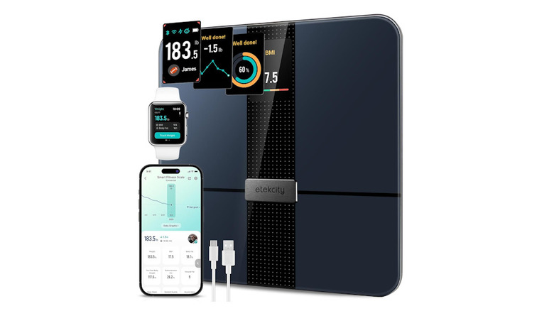 Etekcity scale with highlighted display next to a smartphone with the application turned on